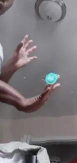 Person with futuristic glowing energy sphere in hands.