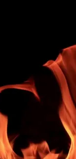 Dynamic fiery flames in red and orange on a dark background wallpaper.