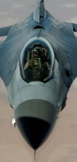 A sleek fighter jet soaring through the sky, captured in an impressive aerial view.