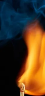 Vivid flame and blue smoke on a dark background.