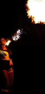 Fire performer with flames in the dark, vibrant and captivating scene.