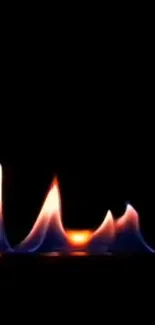 Vibrant flames dancing on a black background, perfect for mobile wallpaper.