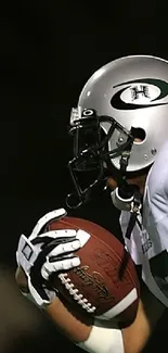 Football player in action on a vibrant green field.