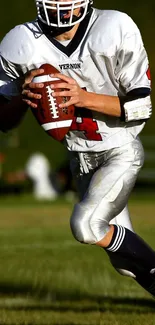 Player holding football on the field in action pose, showcasing sports energy.