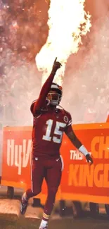 Football player in red uniform with fire background, dynamic mobile wallpaper.