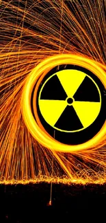 Glowing radiation symbol with sparks in dark setting.