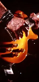 Golden brown guitar played live with dynamic movement and musical energy.