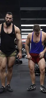 Two muscular individuals working out intensely in gym.