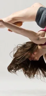 Gymnast in a dynamic pose showcasing flexibility and balance.