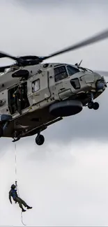 Helicopter in flight against a cloudy sky.