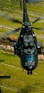 Helicopter flying over lush green fields showcasing aviation dynamics.