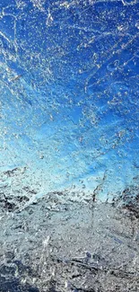 Icy surface with vibrant blue sky background.