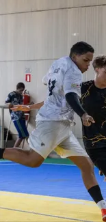 Intense indoor soccer match in action.