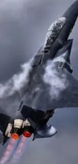 Jet fighter soaring through stormy skies with vapor trails.