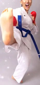 Karate practitioner performs dynamic kick in white uniform with blue belt.