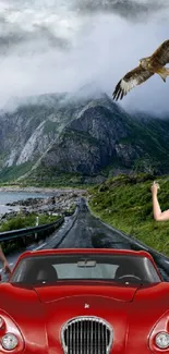 Stunning red car with mountain and eagle backdrop on scenic road.