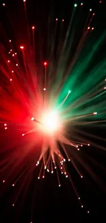 Dynamic burst of red and green lights on a black background wallpaper.