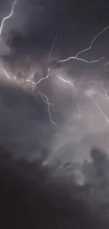 Dramatic lightning striking through dark clouds in a storm.