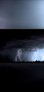 Dark night sky with lightning illuminating the horizon in a powerful storm.