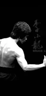 Iconic martial arts figure in dynamic, black and white wallpaper.