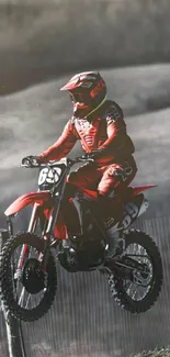 Motocross rider mid-jump in red gear.