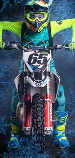 Motocross rider in vibrant gear on motorcycle against a snowy backdrop.