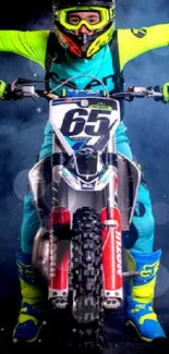 Motocross rider in vibrant gear on a motorcycle with a smoky background.