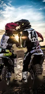 Motocross riders enjoy a sunset adventure on bikes.