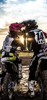 Motocross riders at sunset on a muddy track.