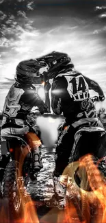 Two motocross riders with fiery effects against a dramatic cloudy sky.