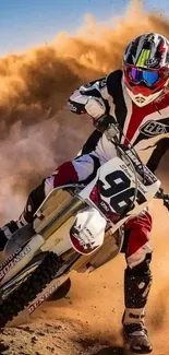 Motocross rider kicking up dirt at high speed.