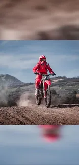 Motocross rider in red gear jumping on rough terrain.