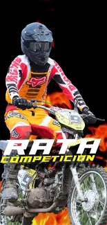 Motocross rider in full gear racing through flames against a dark background.