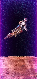 Motocross rider jumping high on dirt track against clear sky.