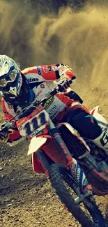 Motocross rider on dirt track in action-packed wallpaper.