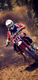 Motocross racer on dirt track in action with dust flying around.