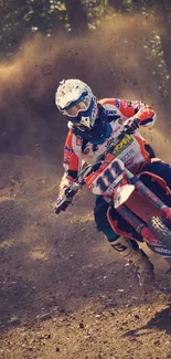 Motocross rider in action, kicking up dirt on a rugged track.