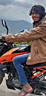 Motorcyclist in leather jacket amidst mountains.