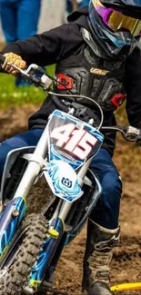 Motocross rider on dirt bike in action.