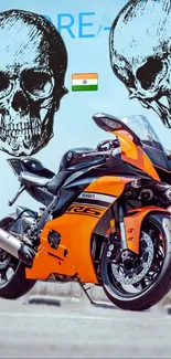 Orange and black motorcycle with skull art in dynamic design.