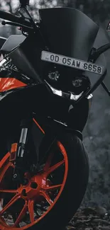 Dynamic black motorcycle with orange wheels on a forest backdrop.