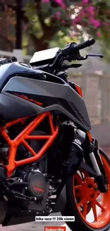 Motorcycle with orange details on a scenic road.