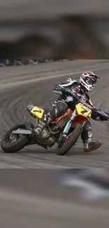 Motorcycle racer leaning into a sharp curve on track.