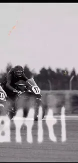 Motorcycles racing on track with helmets.