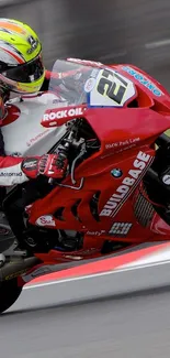 Red superbike in a thrilling racing action on track.