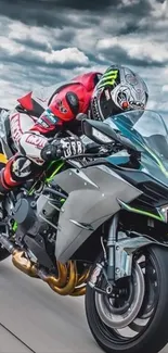 Motorcycle racer in full motion on a dynamic road.