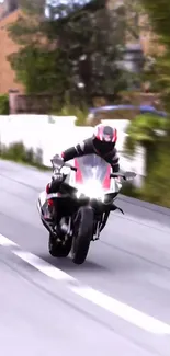 Motorcycle speeding on sunlit road with blurred background.