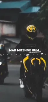 Motorcyclist in yellow helmet on urban road, black and yellow theme.