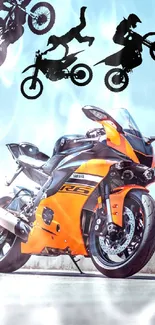 Orange sportbike with stunt silhouettes under blue sky.