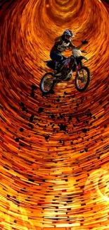 Motorcyclist riding through vibrant orange tunnel.